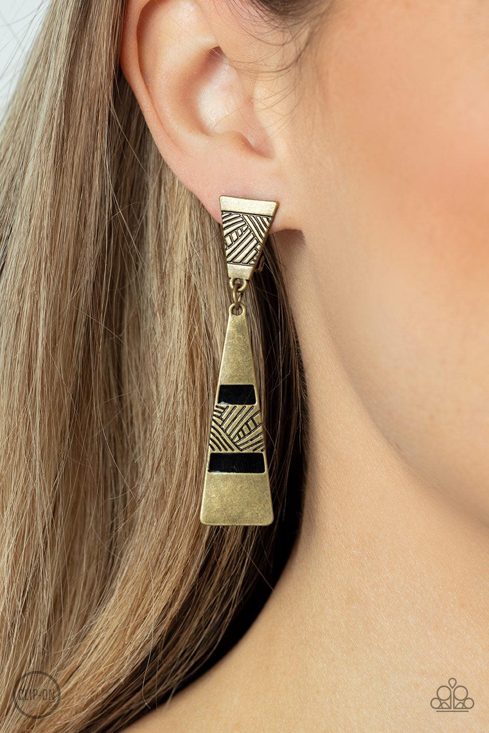 Safari Seeker Brass Clip-on Earrings - Paparazzi Accessories-on model - CarasShop.com - $5 Jewelry by Cara Jewels