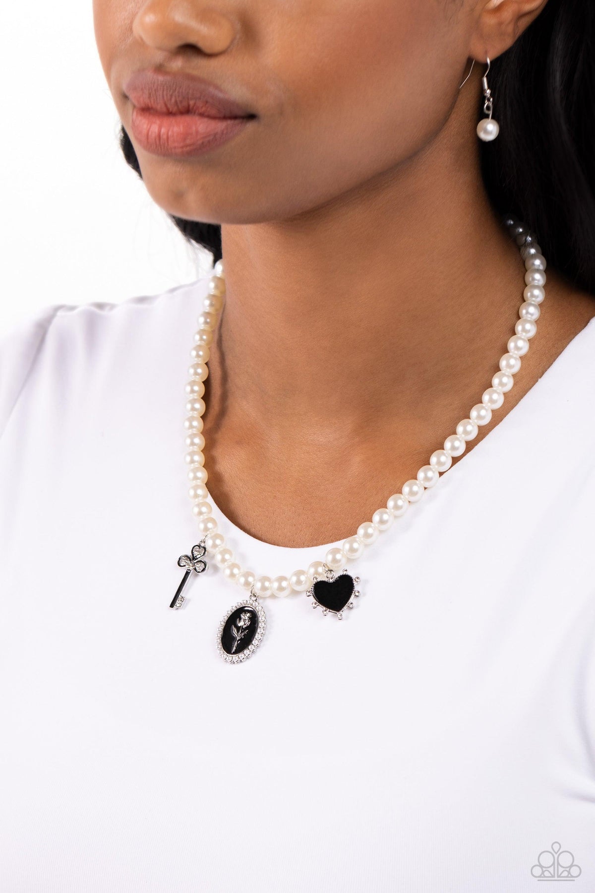Charming Collision Black Charm &amp; White Pearl Necklace - Paparazzi Accessories-on model - CarasShop.com - $5 Jewelry by Cara Jewels