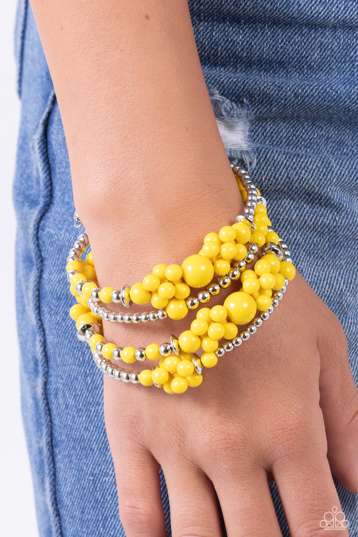 Compelling Clouds Yellow Coil Bracelet - Paparazzi Accessories-on model - CarasShop.com - $5 Jewelry by Cara Jewels