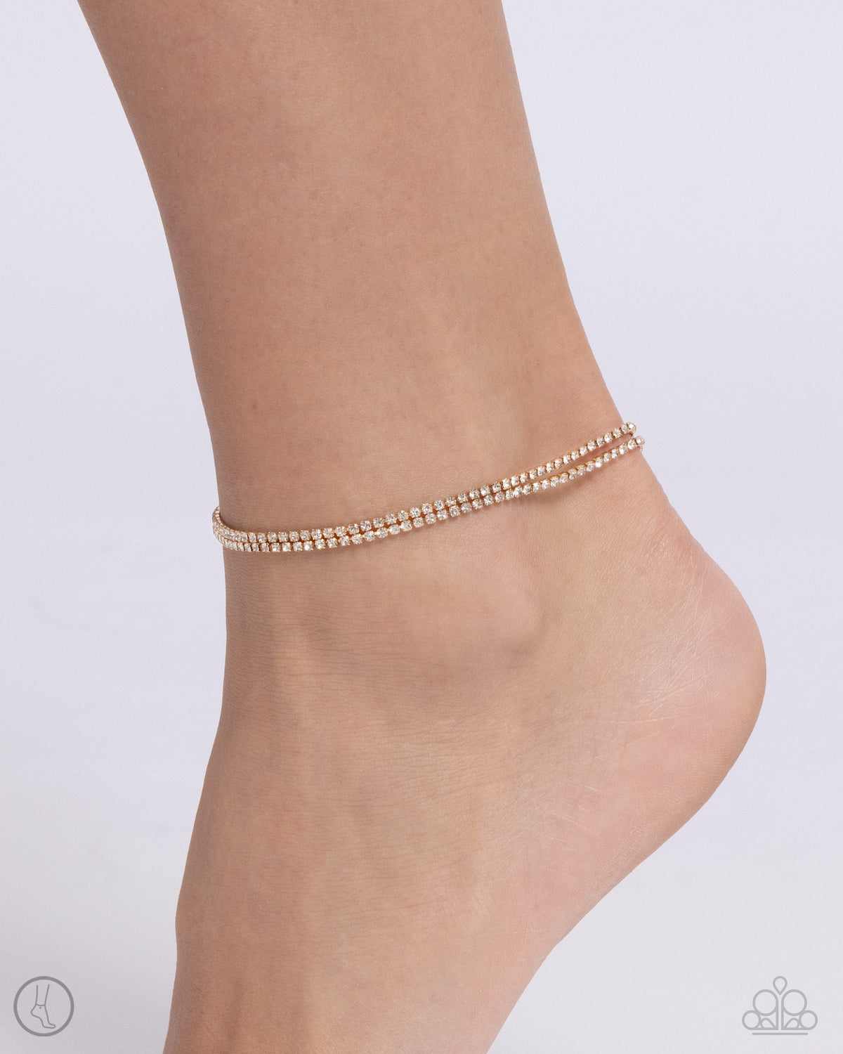 Dainty Declaration Gold &amp; White Rhinestone Anklet - Paparazzi Accessories-on model - CarasShop.com - $5 Jewelry by Cara Jewels