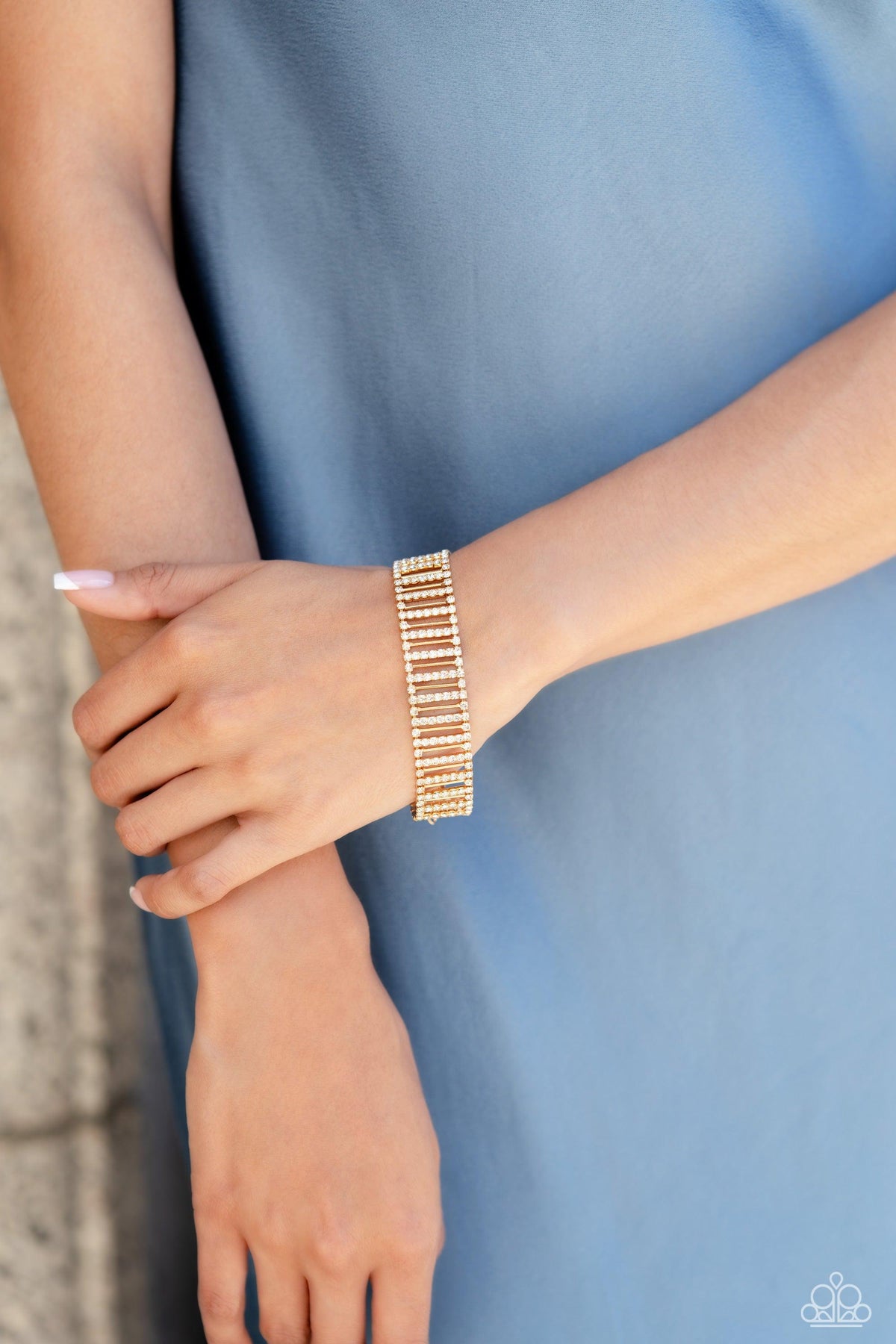 Elusive Elegance Gold &amp; White Rhinestone Bracelet - Paparazzi Accessories-on model - CarasShop.com - $5 Jewelry by Cara Jewels