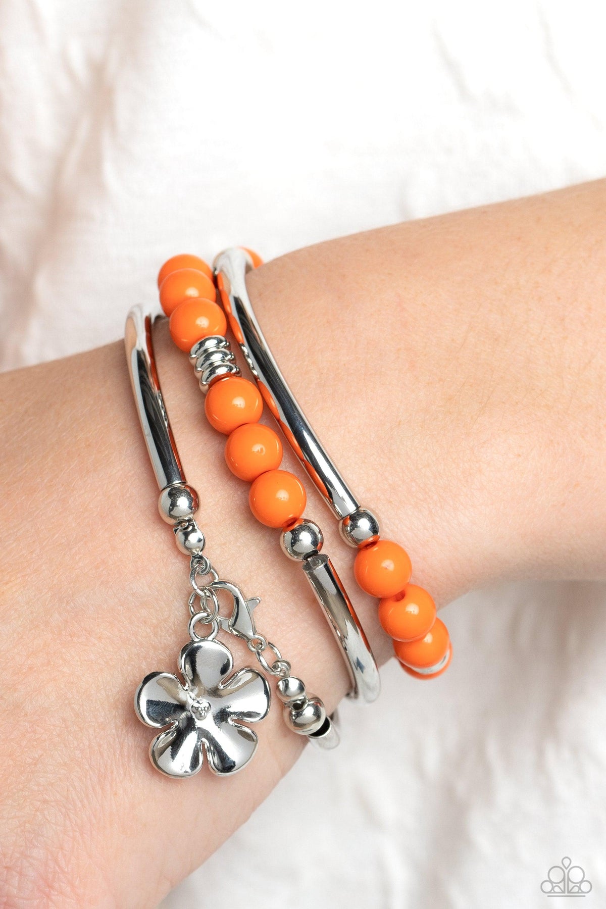 Off the WRAP Orange Floral Coil Bracelet - Paparazzi Accessories-on model - CarasShop.com - $5 Jewelry by Cara Jewels
