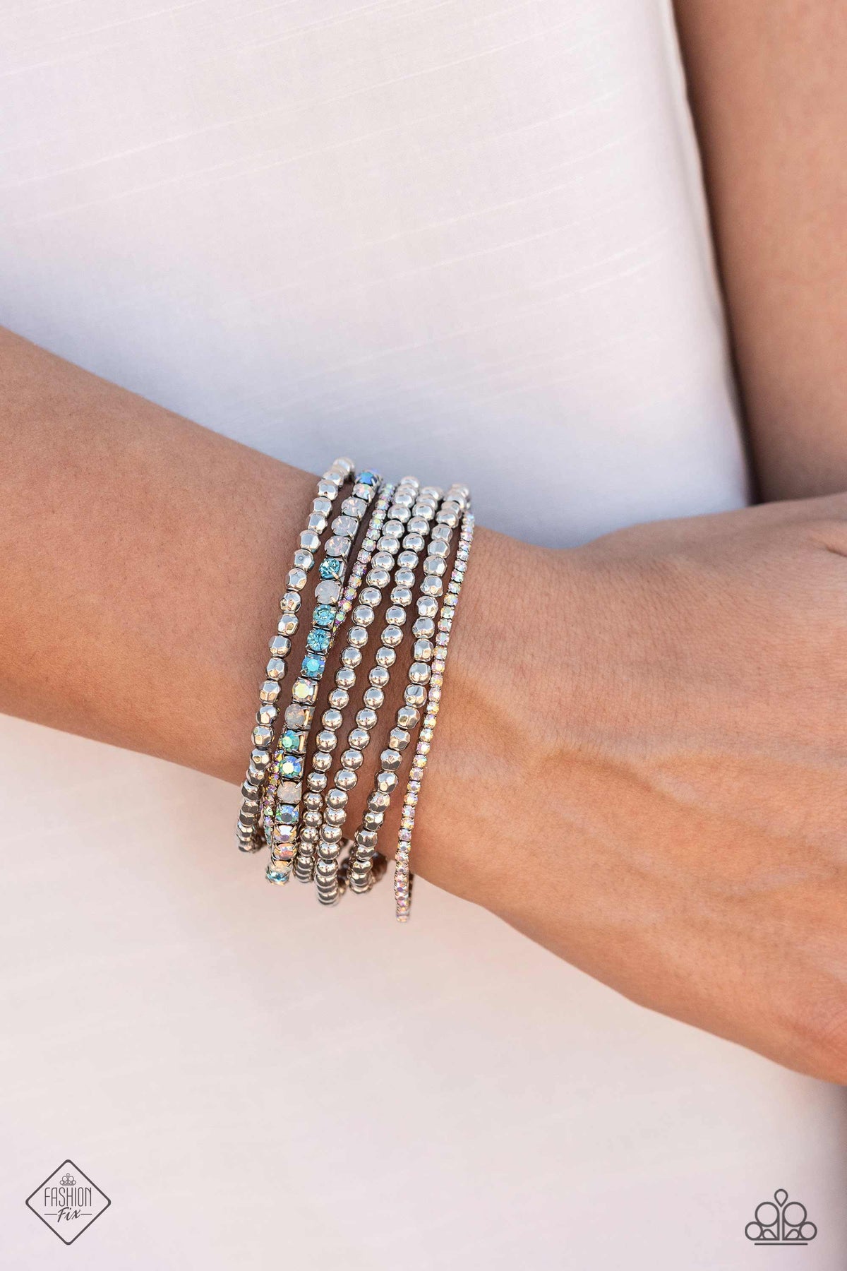 Stellar Sequence Blue &amp; Iridescent Rhinestone Bracelet - Paparazzi Accessories-on model - CarasShop.com - $5 Jewelry by Cara Jewels