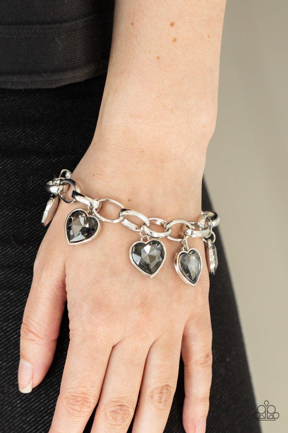 Candy Heart Charmer Silver Rhinestone Heart Charm Bracelet - Paparazzi Accessories- model - CarasShop.com - $5 Jewelry by Cara Jewels