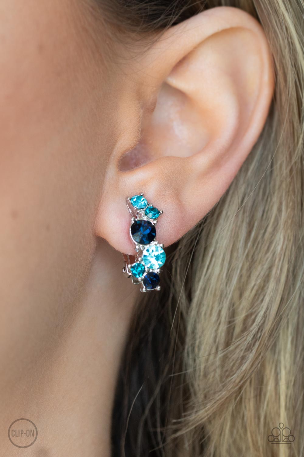 Cosmic Celebration Blue Rhinestone Clip-on Earrings - Paparazzi Accessories- model - CarasShop.com - $5 Jewelry by Cara Jewels