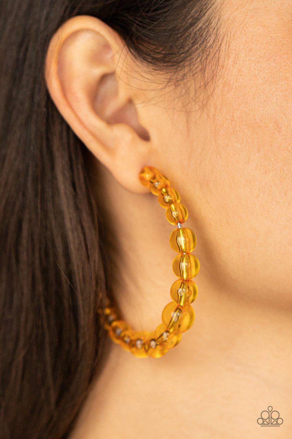In The Clear Orange Hoop Earrings - Paparazzi Accessories- model - CarasShop.com - $5 Jewelry by Cara Jewels