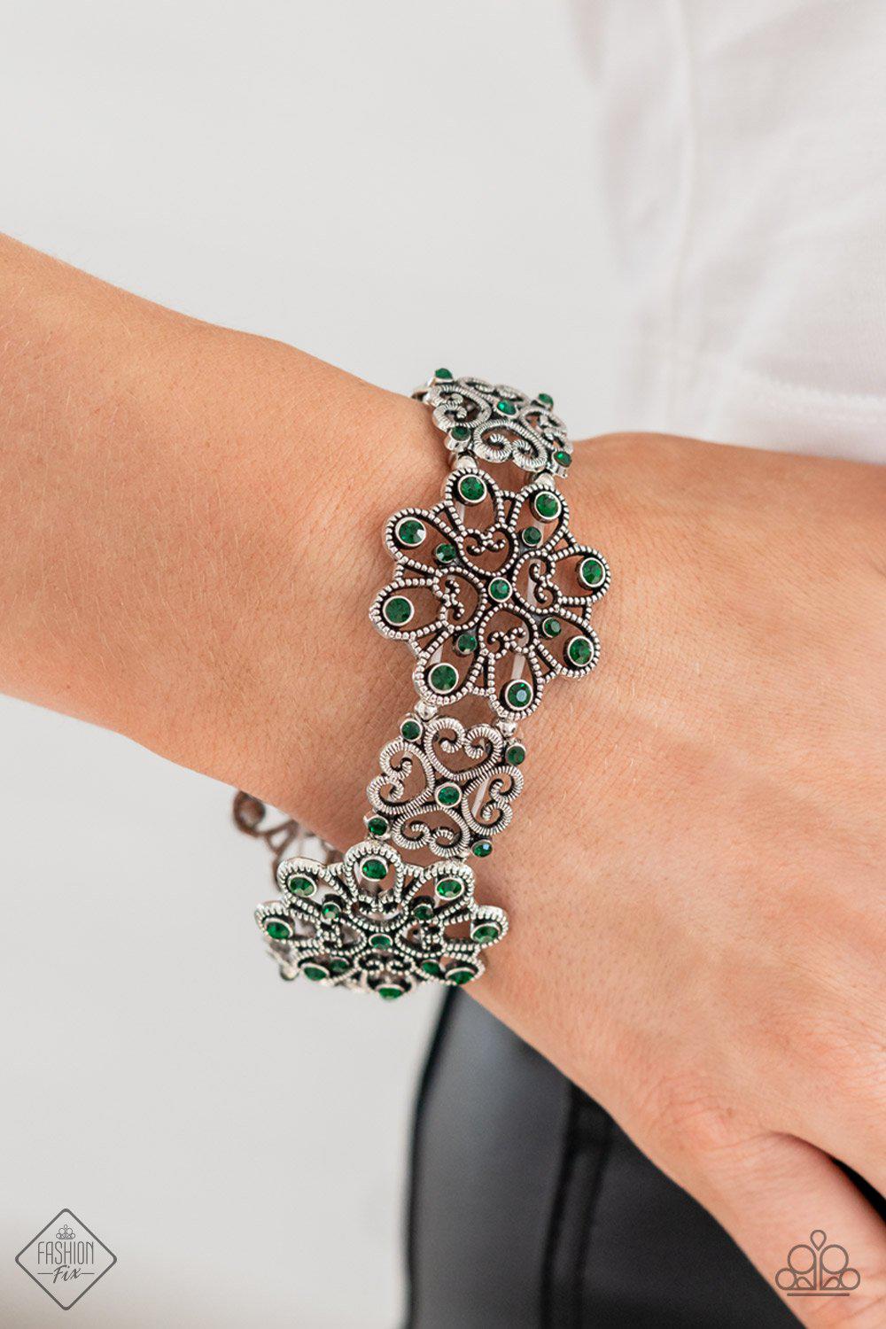Regal Recognition Green Rhinestone and Silver Filigree Bracelet - Paparazzi Accessories- model - CarasShop.com - $5 Jewelry by Cara Jewels