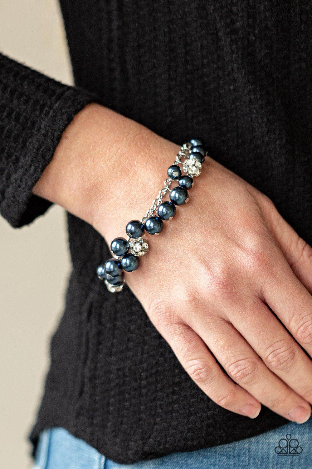The GRANDEUR Tour Blue and Silver Bracelet - Paparazzi Accessories- model - CarasShop.com - $5 Jewelry by Cara Jewels