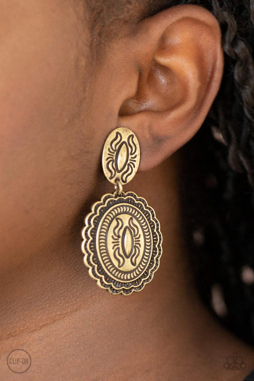 Ageless Artifact Brass Clip-On Earrings - Paparazzi Accessories - model -CarasShop.com - $5 Jewelry by Cara Jewels