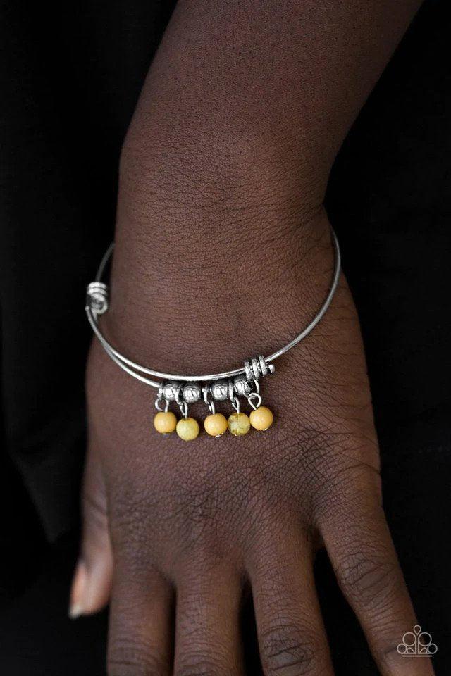 All Roads Lead To ROAM Yellow Bracelet - Paparazzi Accessories- on model - CarasShop.com - $5 Jewelry by Cara Jewels