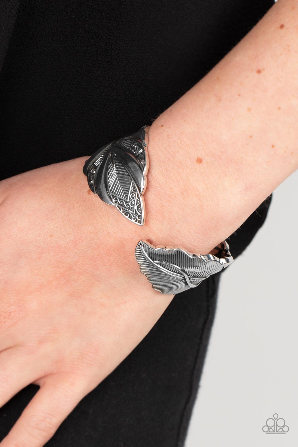 American Art Silver Feather Bracelet - Paparazzi Accessories-on model - CarasShop.com - $5 Jewelry by Cara Jewels