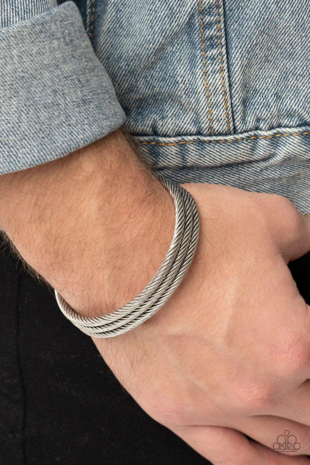 Armored Cable Men&#39;s Silver Cuff Bracelet - Paparazzi Accessories- on model - CarasShop.com - $5 Jewelry by Cara Jewels