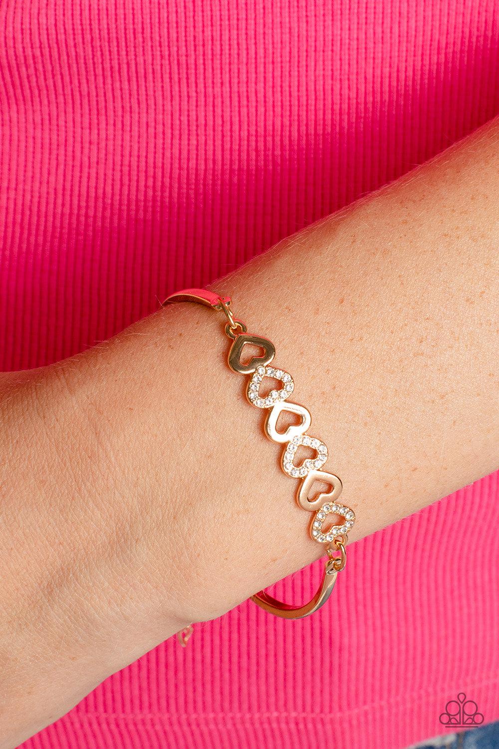 Attentive Admirer Gold Heart Bracelet - Paparazzi Accessories-on model - CarasShop.com - $5 Jewelry by Cara Jewels