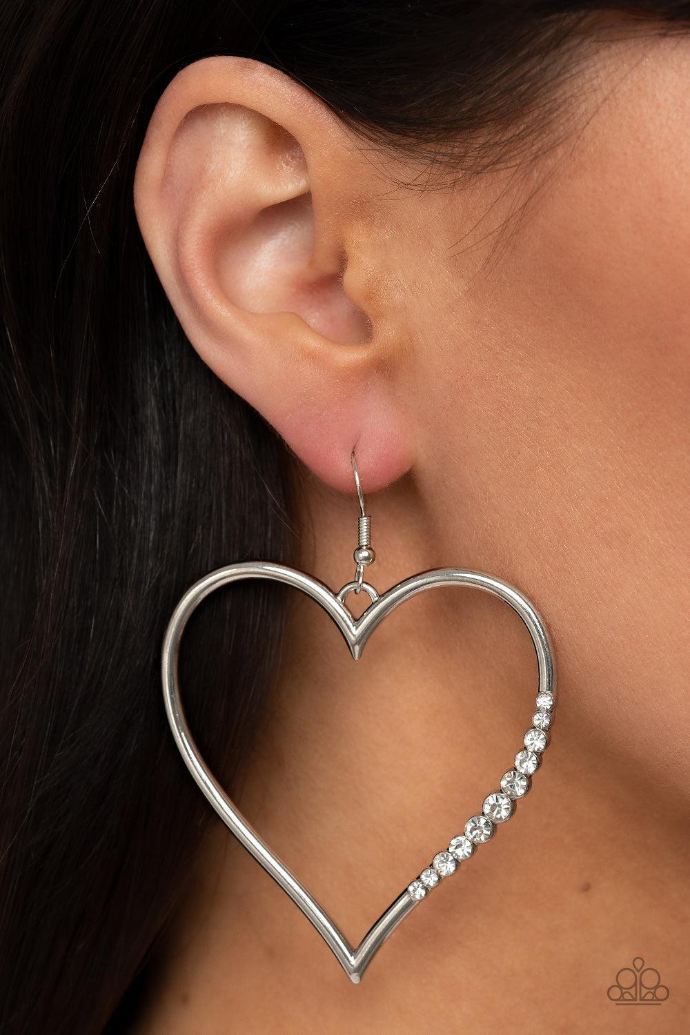 Bewitched Kiss White Rhinestone Heart Earrings - Paparazzi Accessories- on model - CarasShop.com - $5 Jewelry by Cara Jewels