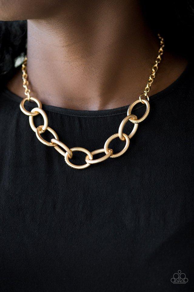 Boldly Bronx Gold Necklace - Paparazzi Accessories - model -CarasShop.com - $5 Jewelry by Cara Jewels