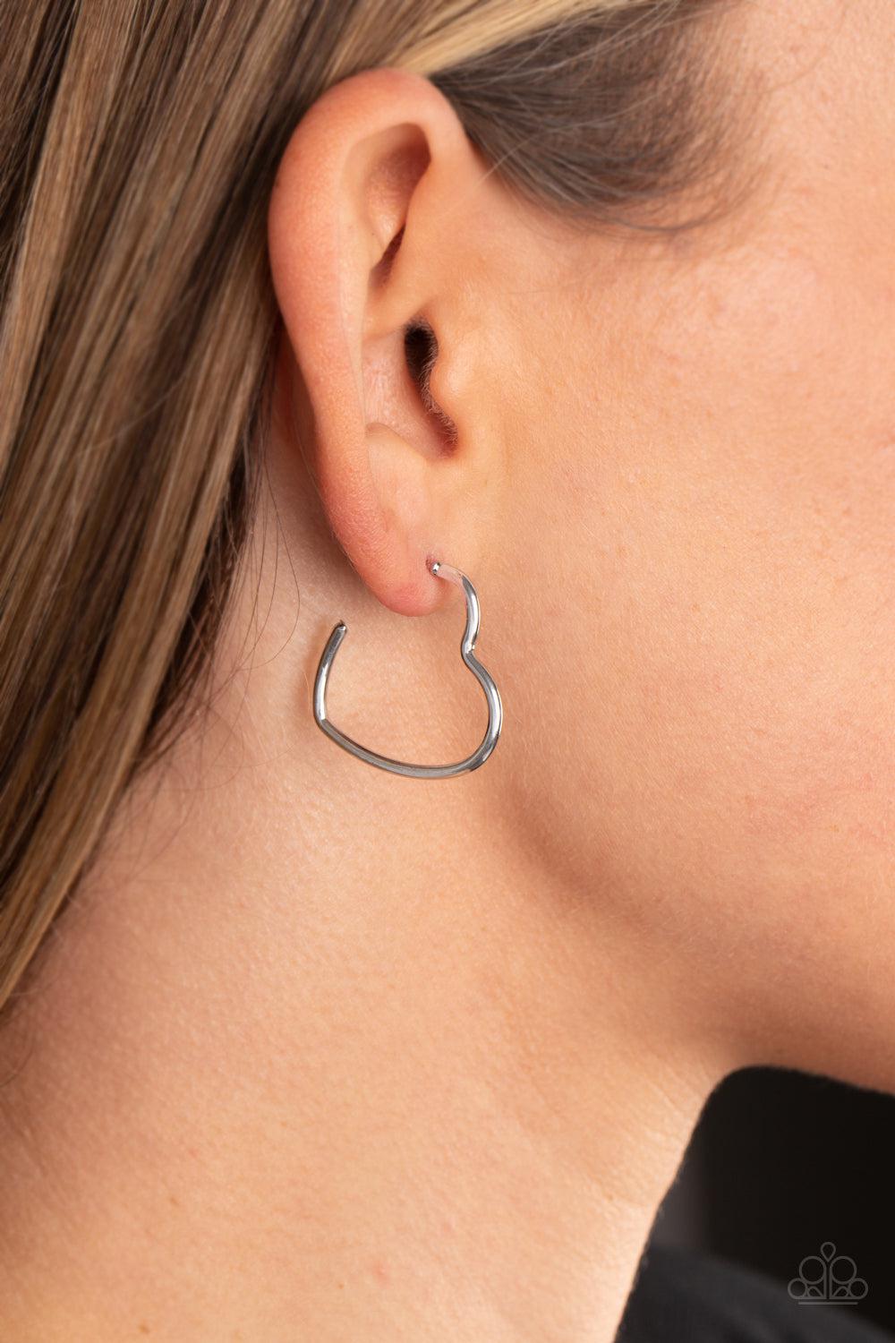 Burnished Beau Silver Heart Hoop Earrings - Paparazzi Accessories-on model - CarasShop.com - $5 Jewelry by Cara Jewels