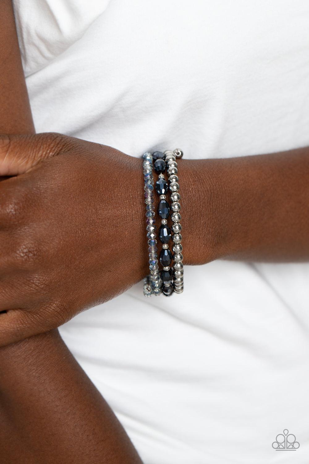 Celestial Chapter Blue Coil Bracelet - Paparazzi Accessories-on model - CarasShop.com - $5 Jewelry by Cara Jewels