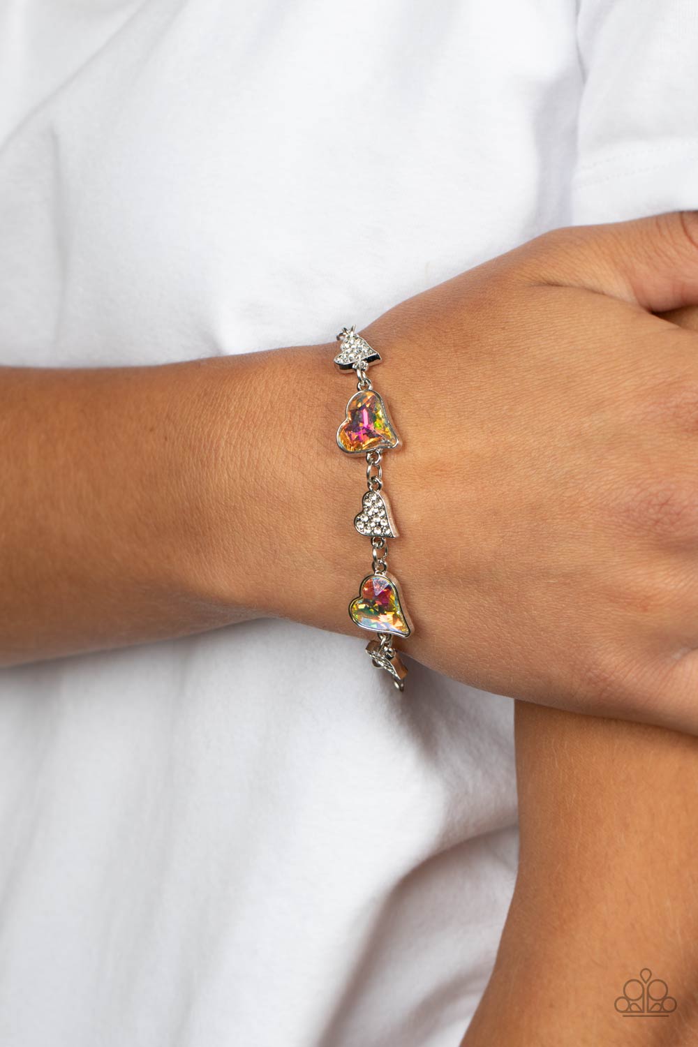 Cluelessly Crushing Multi Iridescent Rhinestone Heart Bracelet - Paparazzi Accessories-on model - CarasShop.com - $5 Jewelry by Cara Jewels