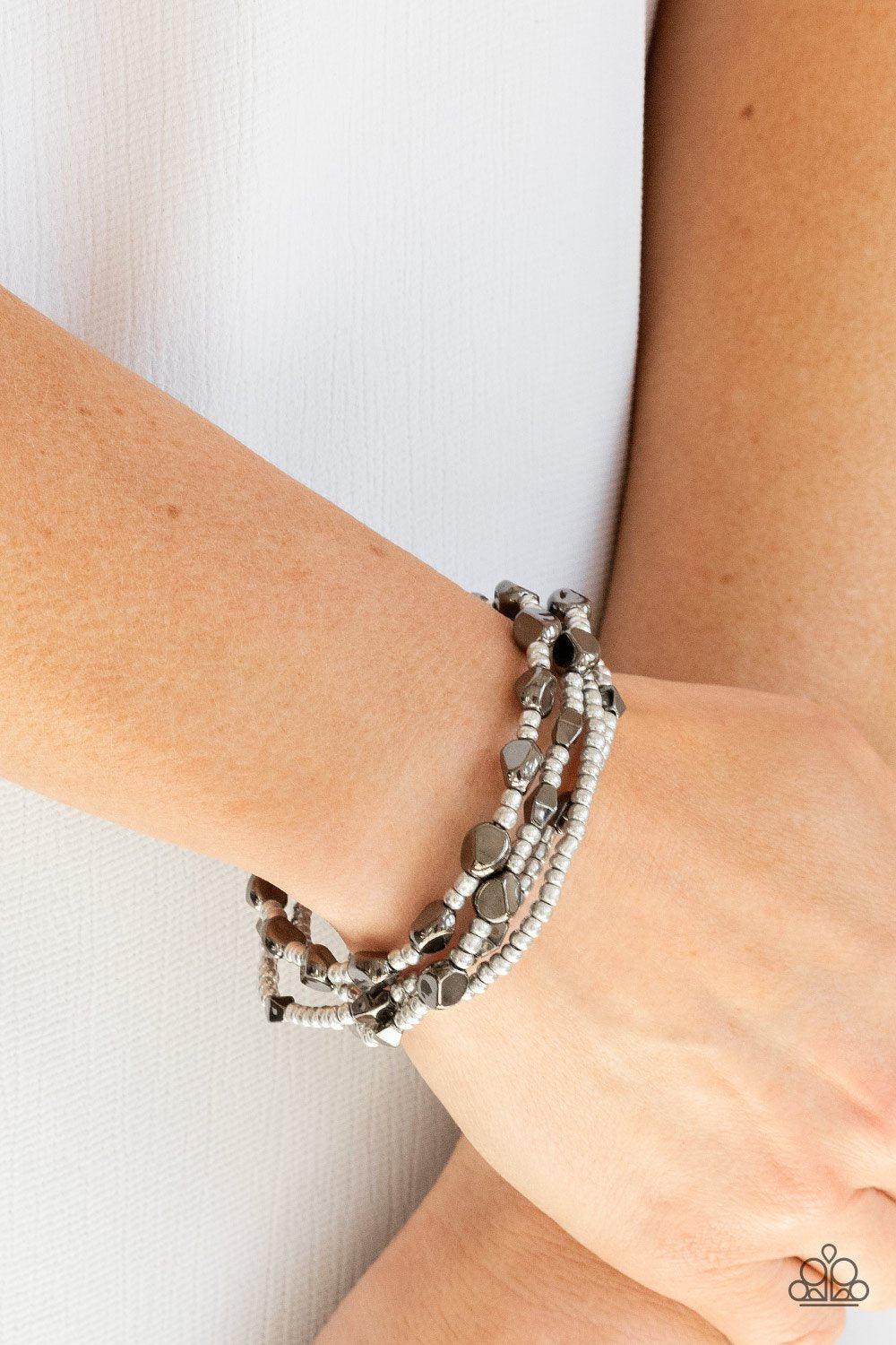 Fashionably Faceted Multi Silver and Gunmetal Bracelet Set - Paparazzi Accessories- model - CarasShop.com - $5 Jewelry by Cara Jewels