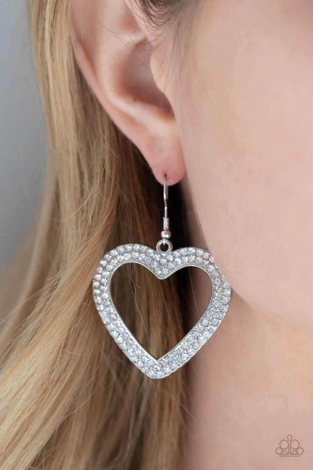 GLISTEN To Your Heart Silver and White Rhinestone Heart Earrings - Paparazzi Accessories - model -CarasShop.com - $5 Jewelry by Cara Jewels
