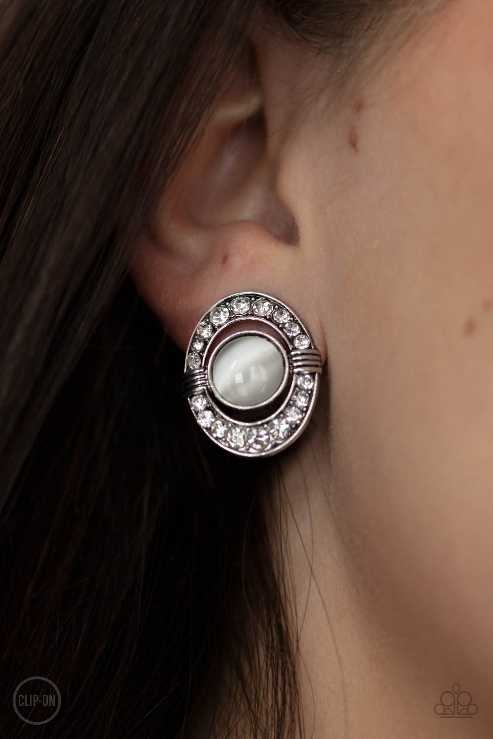 GLOW of Force White Cat&#39;s Eye and Rhinestone Clip-on Earrings - Paparazzi Accessories- model - CarasShop.com - $5 Jewelry by Cara Jewels