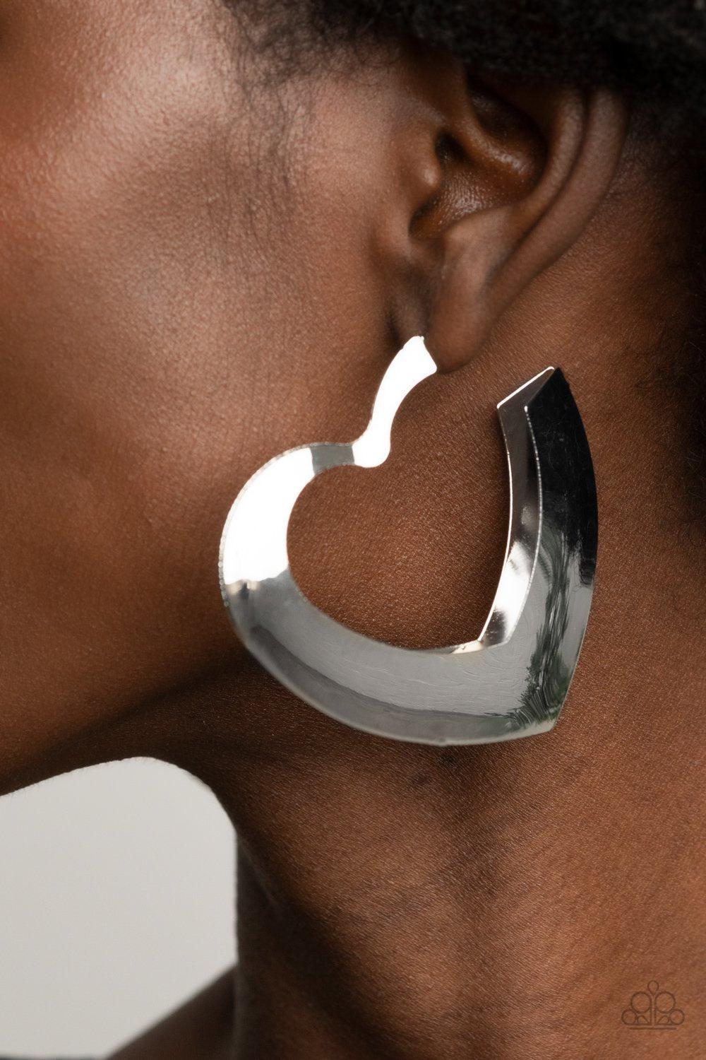 Heart-Racing Radiance Heart-shaped Hoop Earrings - Paparazzi Accessories- model - CarasShop.com - $5 Jewelry by Cara Jewels