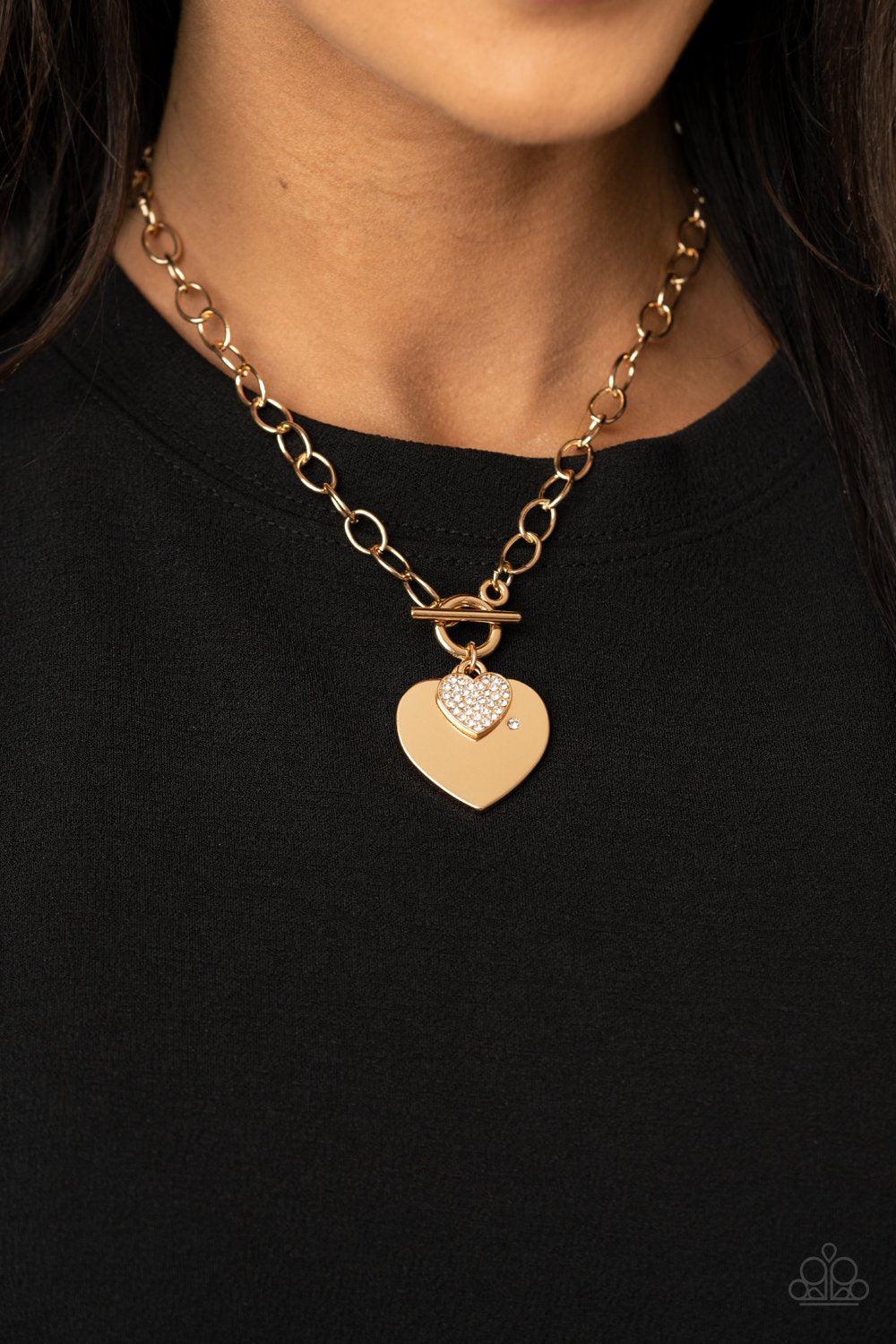 Heart-Stopping Sparkle Gold and White Rhinestone Heart Necklace - Paparazzi Accessories - model -CarasShop.com - $5 Jewelry by Cara Jewels