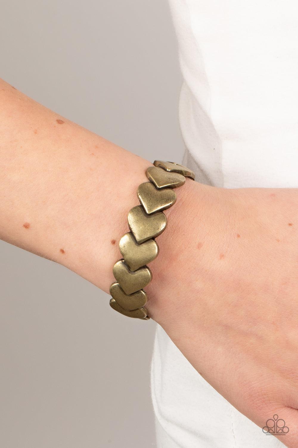 Hearts Galore Brass Cuff Bracelet - Paparazzi Accessories-on model - CarasShop.com - $5 Jewelry by Cara Jewels