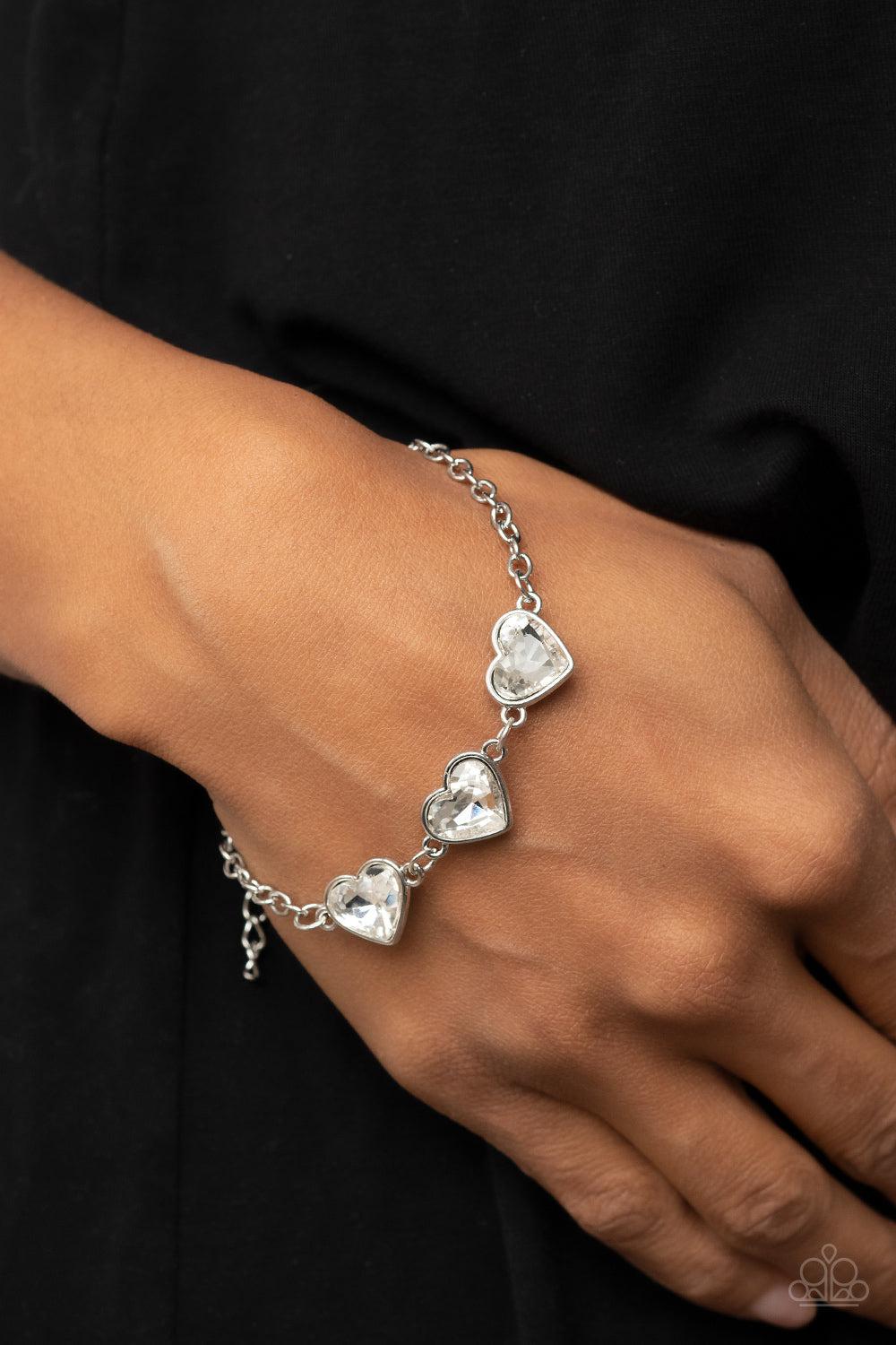 Little Heartbreaker White Rhinestone Heart Bracelet - Paparazzi Accessories- on model - CarasShop.com - $5 Jewelry by Cara Jewels