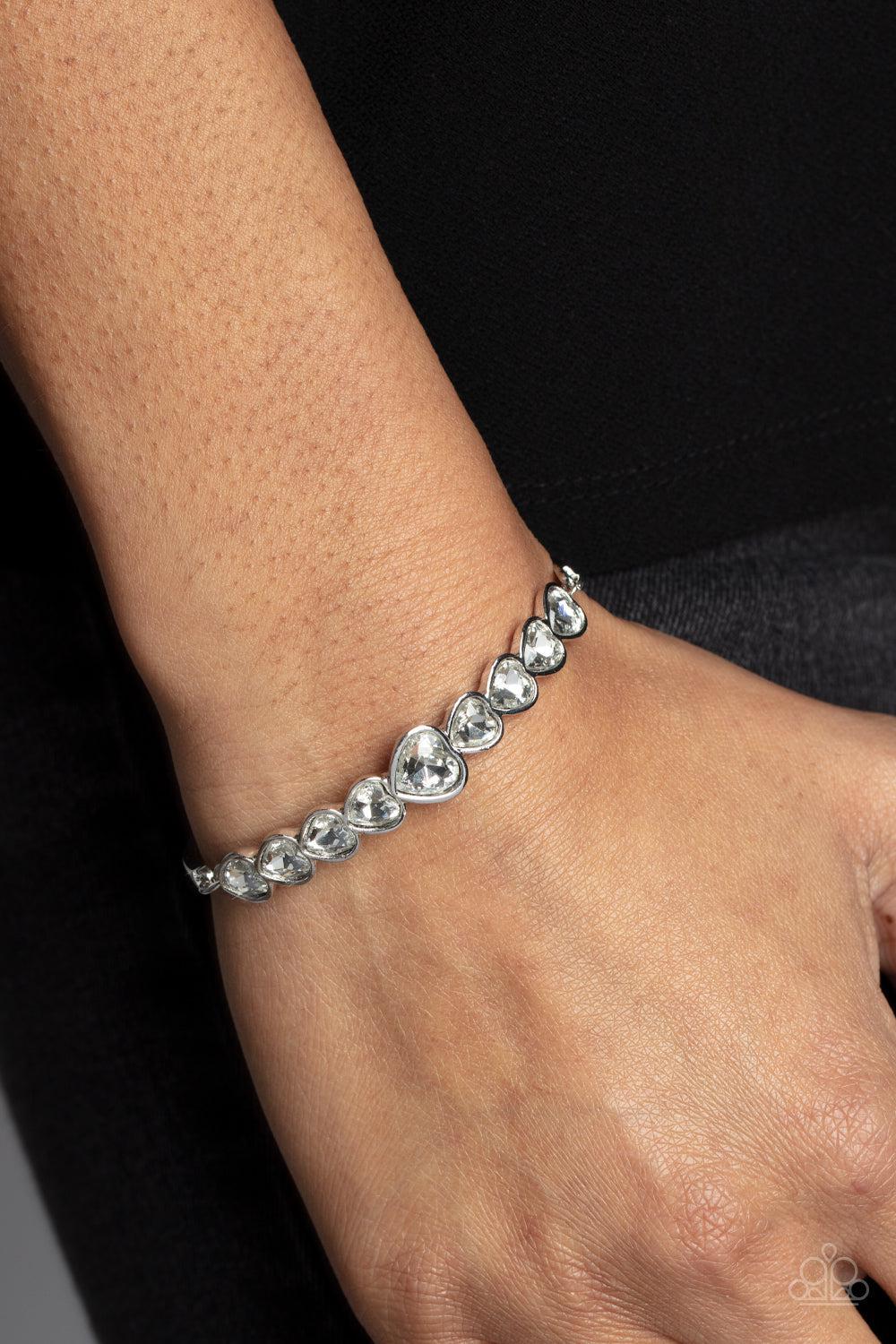 Lusty Luster White Rhinestone Heart Bracelet - Paparazzi Accessories-on model - CarasShop.com - $5 Jewelry by Cara Jewels