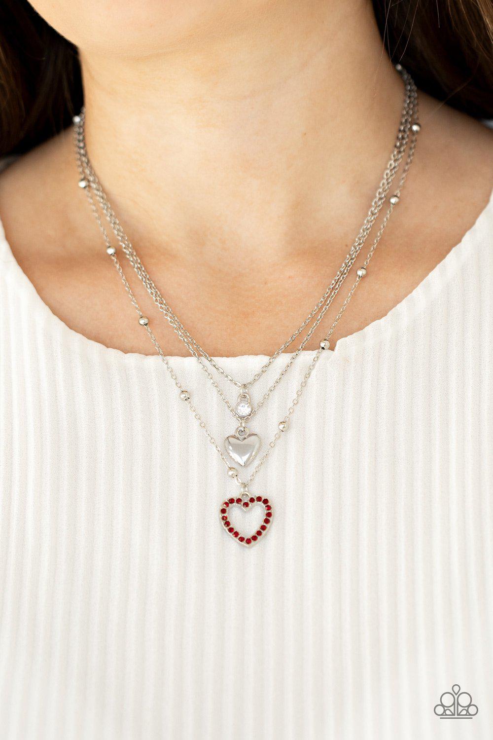 Never Miss a Beat Red Rhinestone and Silver Heart Necklace - Paparazzi Accessories - model -CarasShop.com - $5 Jewelry by Cara Jewels