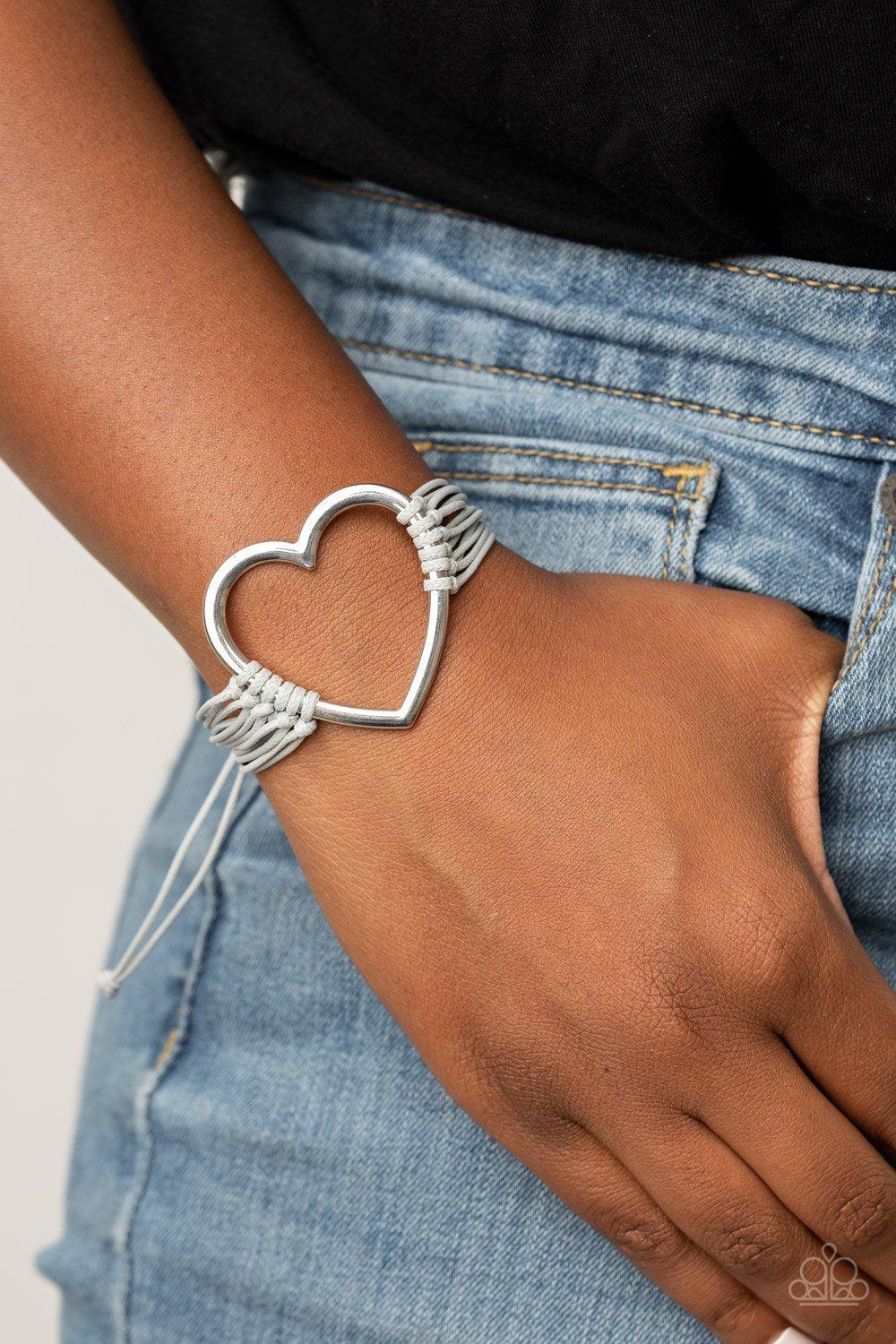 Playing With My HEARTSTRINGS Silver Heart Charm Urban Knot Bracelet - Paparazzi Accessories - model -CarasShop.com - $5 Jewelry by Cara Jewels