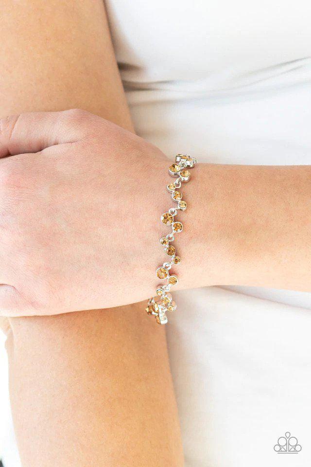 Starlit Stunner Brown Rhinestone Bracelet - Paparazzi Accessories-on model - CarasShop.com - $5 Jewelry by Cara Jewels