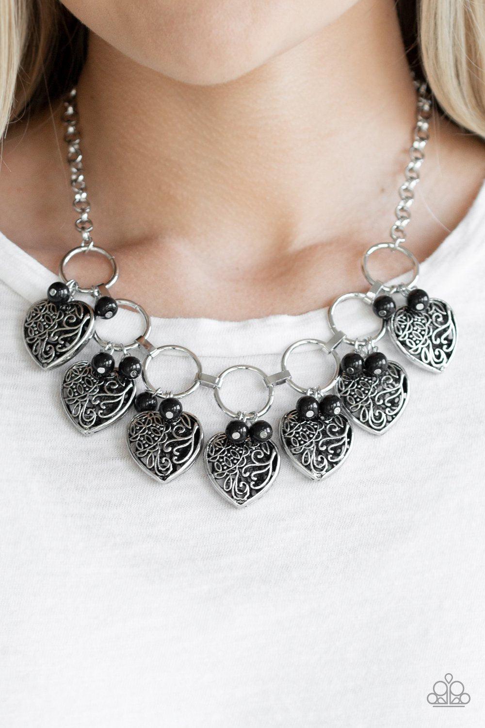 Very Valentine Black and Silver Heart Necklace - Paparazzi Accessories - model -CarasShop.com - $5 Jewelry by Cara Jewels