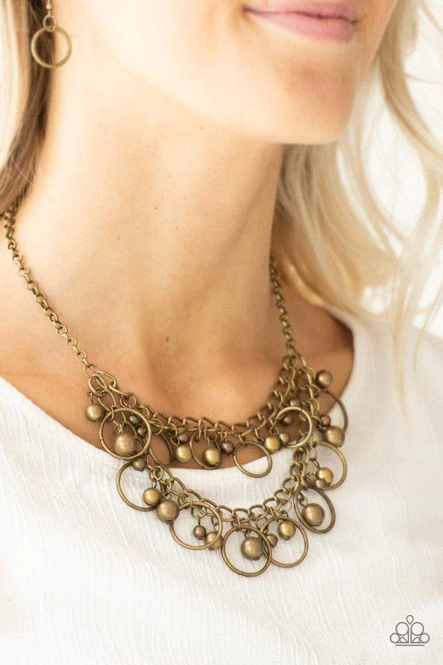 Warning Bells Brass Necklace - Paparazzi Accessories- on model - CarasShop.com - $5 Jewelry by Cara Jewels