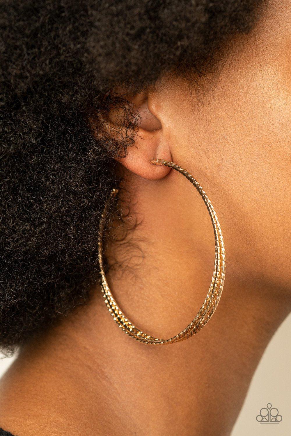 Watch and Learn Gold Hoop Earrings - Paparazzi Accessories - model -CarasShop.com - $5 Jewelry by Cara Jewels